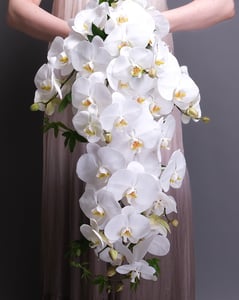 Cascading Bridal Bouquet of White Orchids and Trailing Greens – Florists